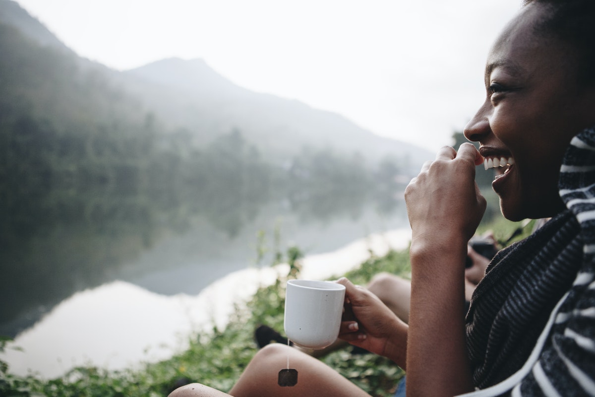 woman-drinking-coffee-while-camping