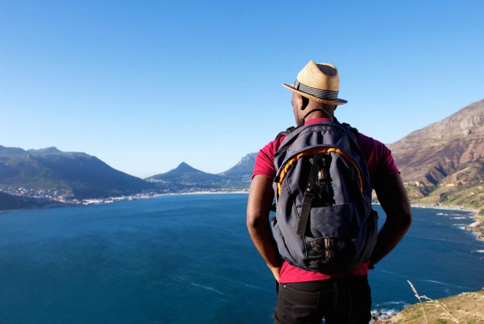 man-looking-out-over-lake