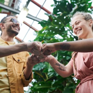 happy people having fist bump