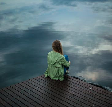 girl sitting at the pier