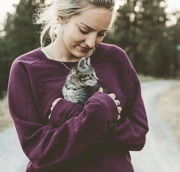 girl holding a cat