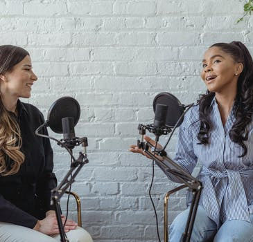 two women having conversation in a podcast