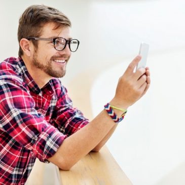 Man smiling at phone