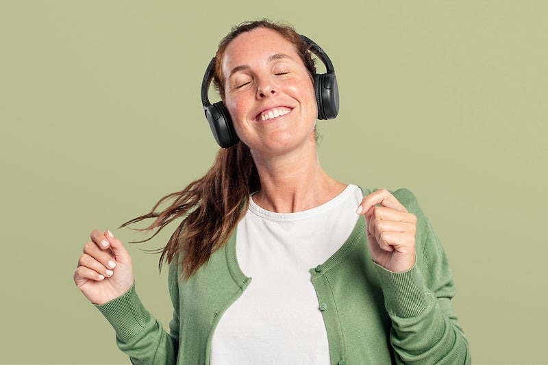 Woman with headphones on listening to music